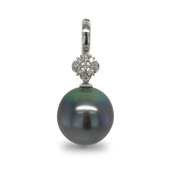 A Tahitian Pearl, oval in shape and 15mm in size, peacock- blue in colour, grade 2 with AAA luster, set on a 14 carat white gold enhancer, with a large diamond set setting, with 9 diamonds totaling 0.10 carats.