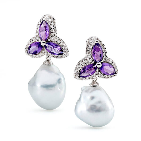 A large pair of 17 mm South Sea Cultured Pearls, baroque in shape and silver in colour, the pearls are grade 1 with a AAA luster, set on a star style setting with amethyst surrounded by 72 diamonds totaling 1.44 carats. The setting is 18 carat white gold and is a stud fitting.