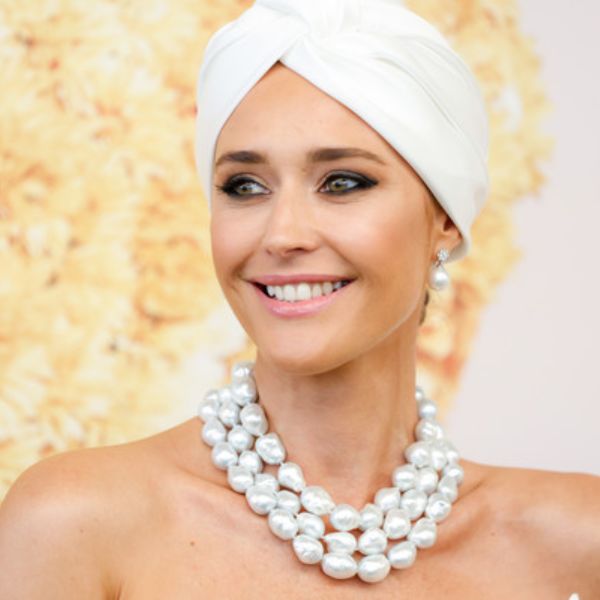 woman wearing a white pearl necklace