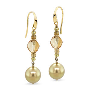 A pair of 11 mm Golden South Sea Pearls, drop shaped, grade 1 with a AAA luster and a strong gold colour set with 8.50 carats of faceted cut Citrine and 1 carat of yellow sapphire beads, with 18 carat yellow gold shepherd hooks.